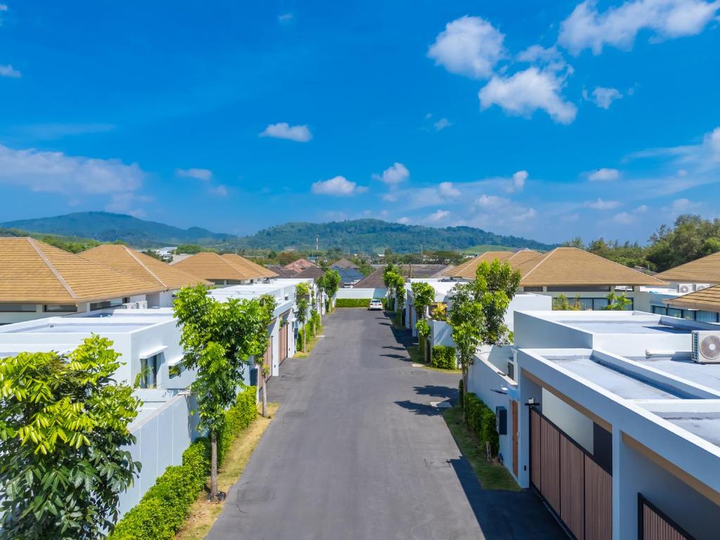 Aerial daytime view of the villa community street