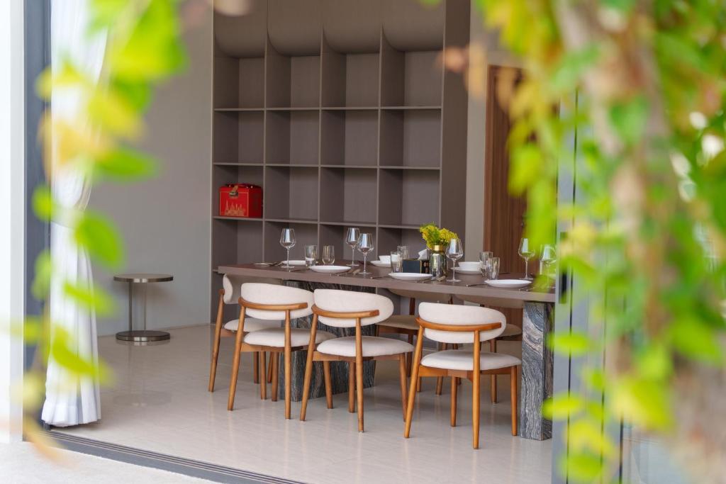 Villa dining nook framed by tropical greenery